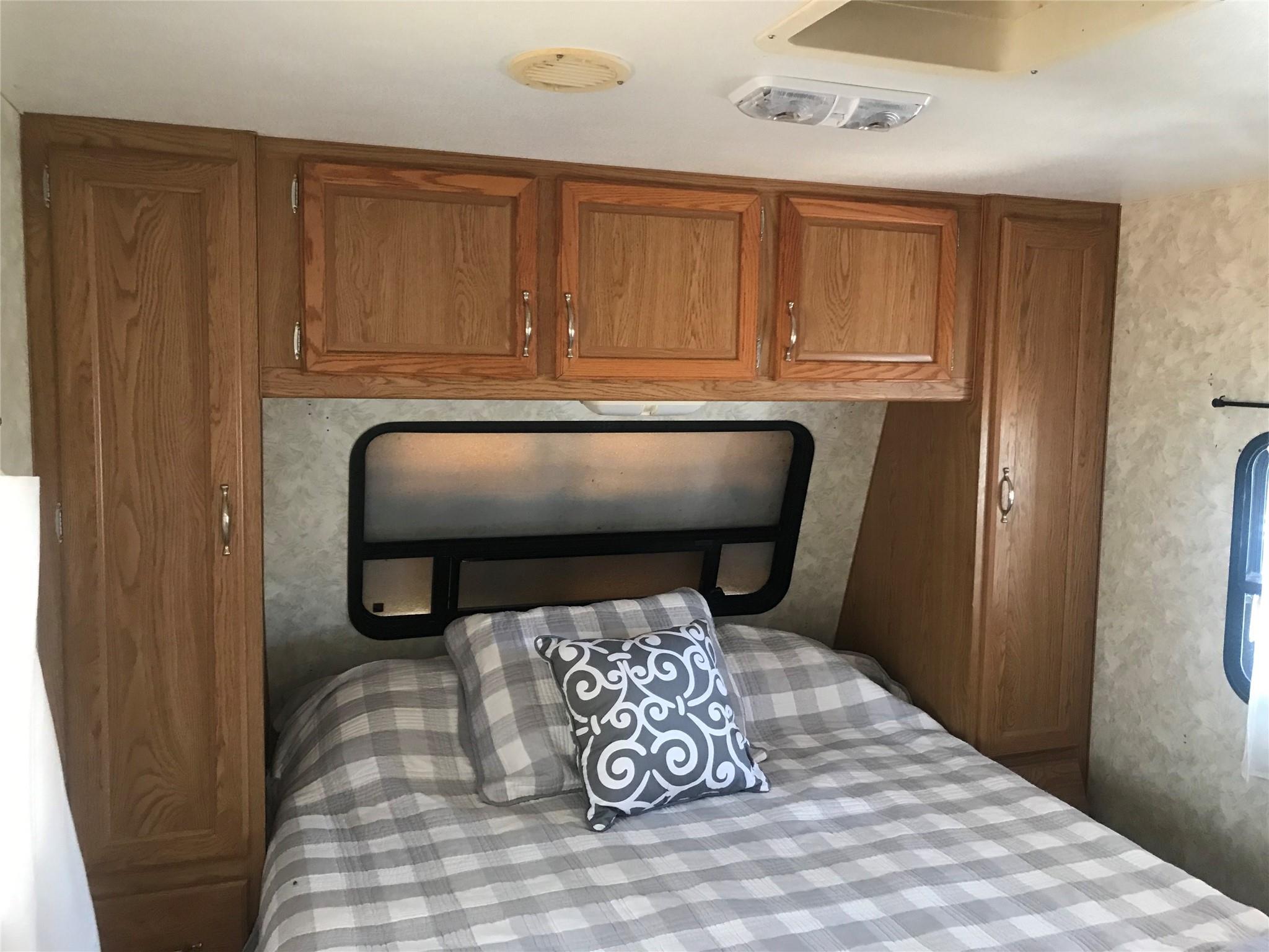 150 Roberts Ridge Road, Unit H48 Mount Gilead, NC 27306 - Photo 23 of 35 a bedroom with a bed and a chair