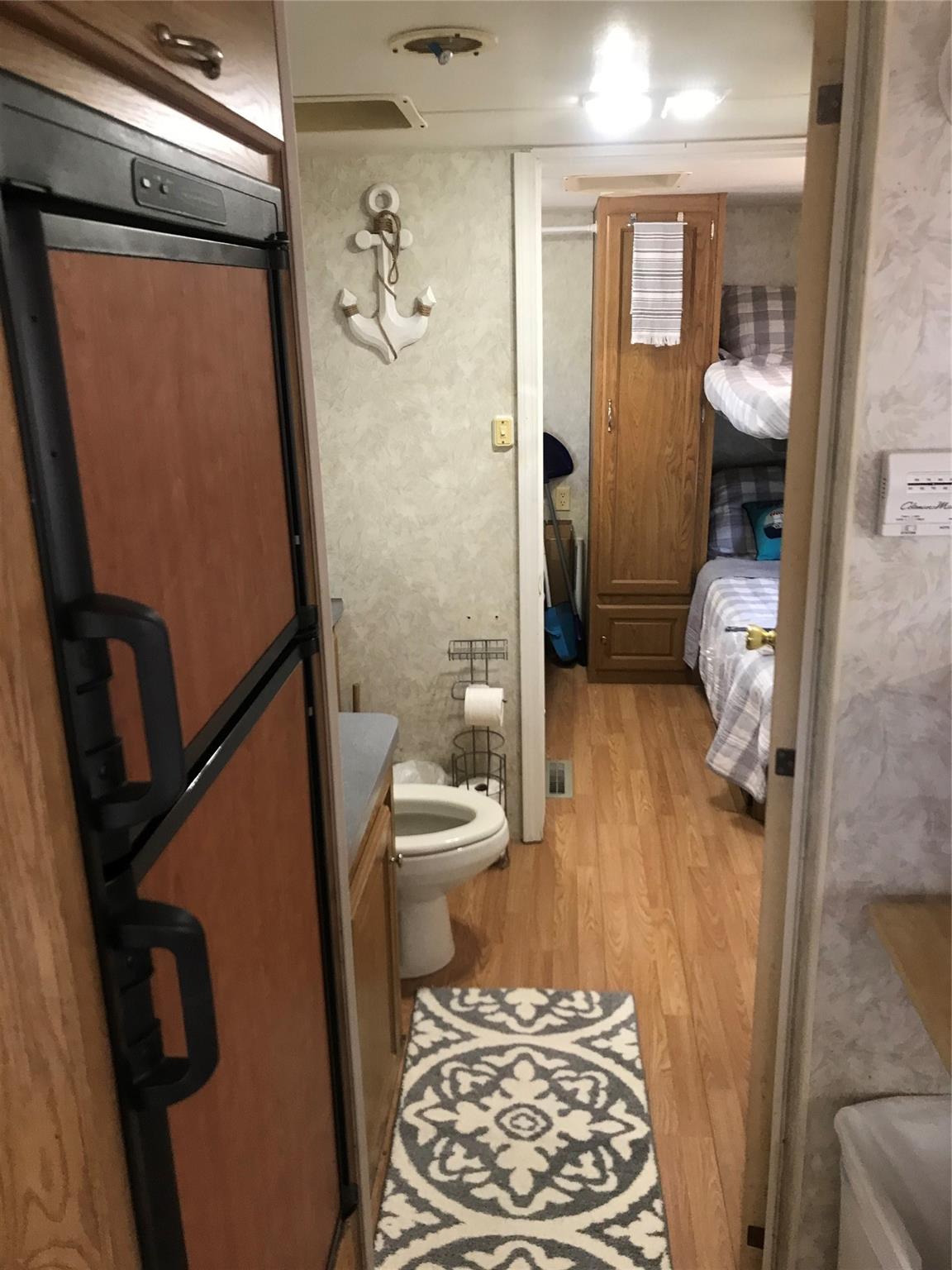 150 Roberts Ridge Road, Unit H48 Mount Gilead, NC 27306 - Photo 32 of 35 a bathroom with a toilet and a shower