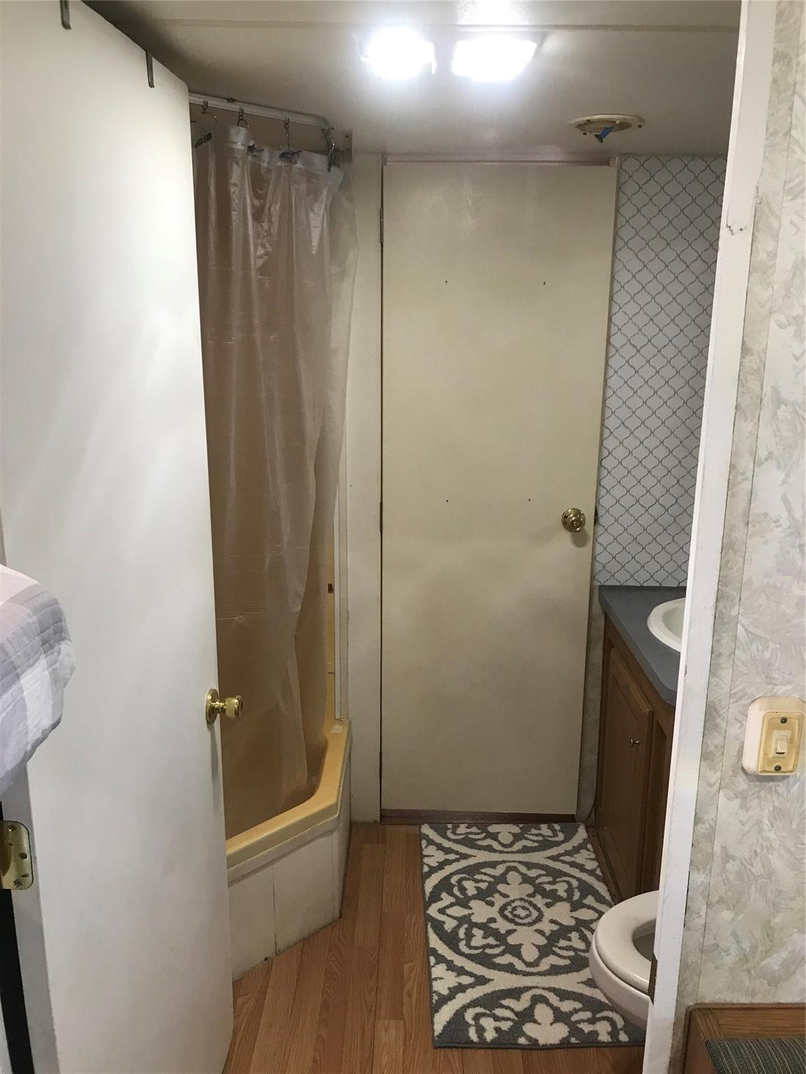 150 Roberts Ridge Road, Unit H48 Mount Gilead, NC 27306 - Photo 33 of 35 a bathroom with a glass door shower and a sink