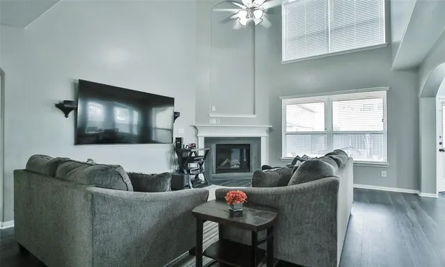 a living room with furniture and a fireplace