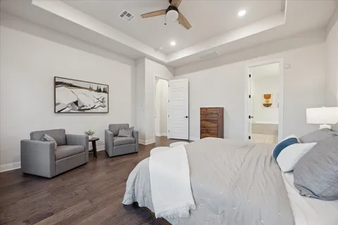 a bedroom with bed and large window