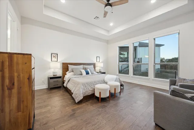 a bedroom with bed and large window