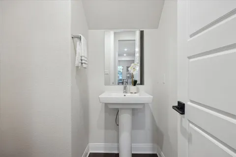 a bathroom with a sink a mirror and a toilet
