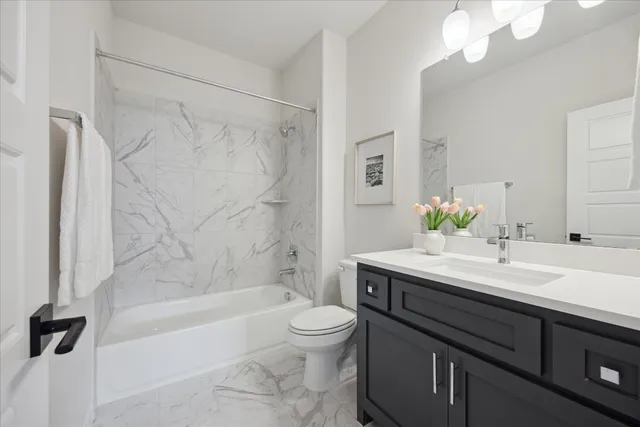 a bathroom with a sink a toilet and a bathtub