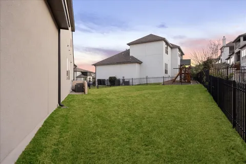 a view of a back yard of the house