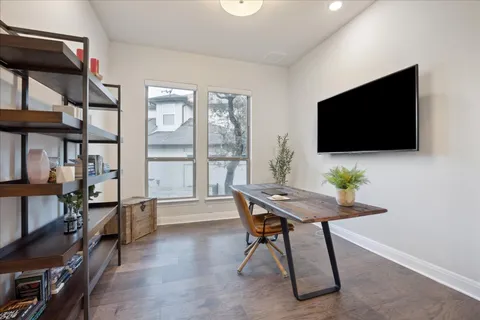 a view of a livingroom with furniture and a flat screen tv