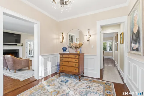 a room with a baby crib furniture and a dresser