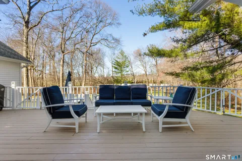 a view of two chairs on the roof deck