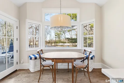 a dining room with furniture and window