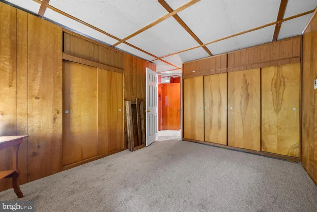a view of a bathroom with shower and a window