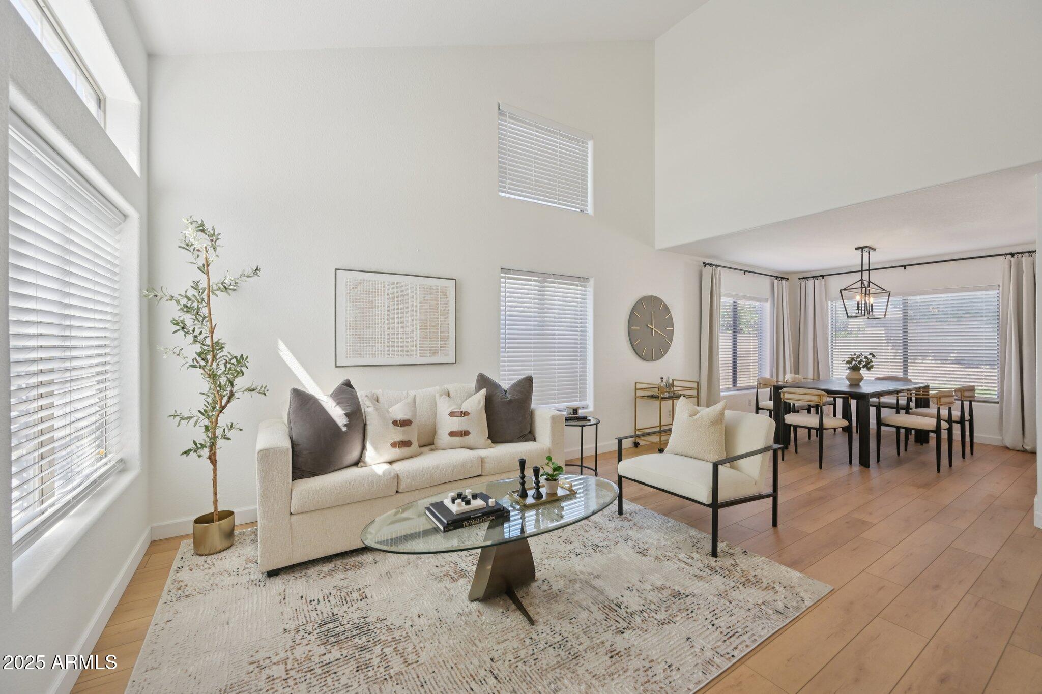 a living room with furniture and a table