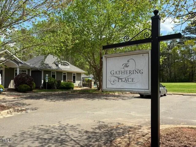 a sign on the side of a street