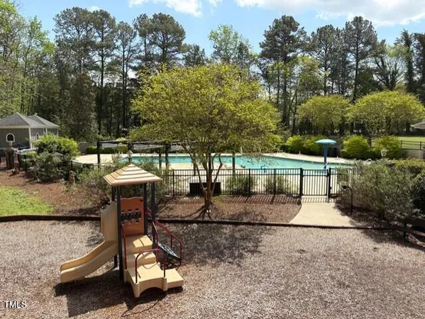 a view of a backyard with sitting area