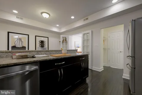 a kitchen with a sink and a refrigerator