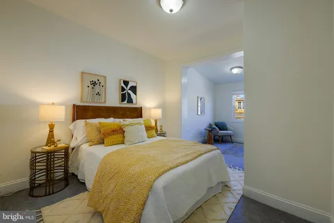 a bed room with a bed and a lamp