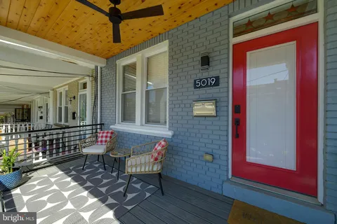 a view of a two chairs in the patio