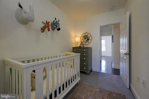 a view of hallway with wooden floor