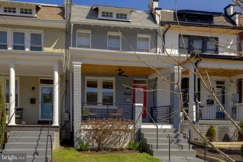 a front view of a building with parking area