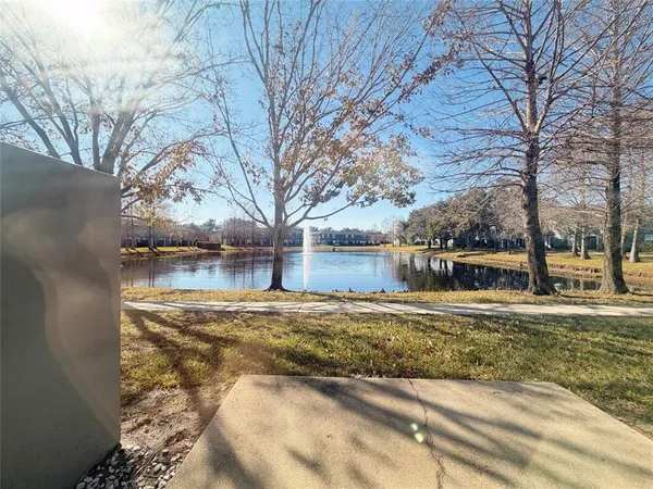 a view of a house with a yard covered with snow