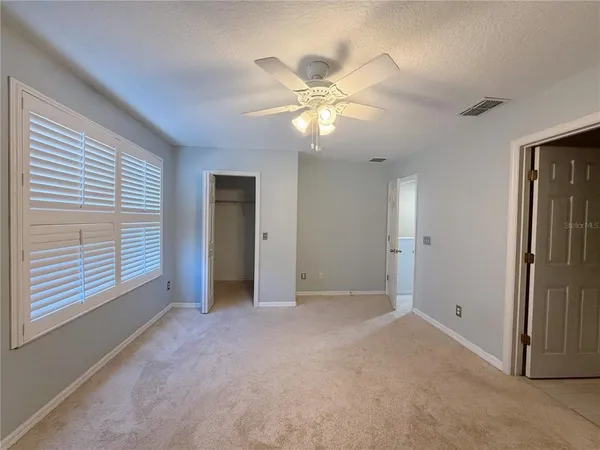 a view of an empty room with a window