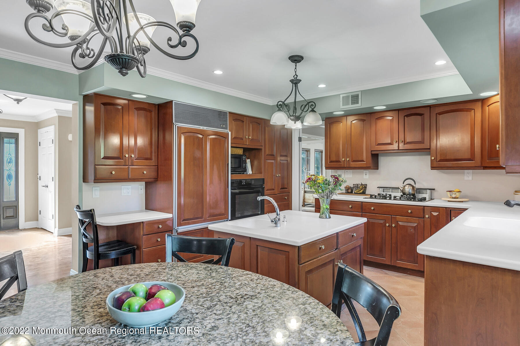 25 Spring Garden Avenue Colts Neck, NJ 07722 - Photo 14 of 58 a large kitchen with a table and chairs