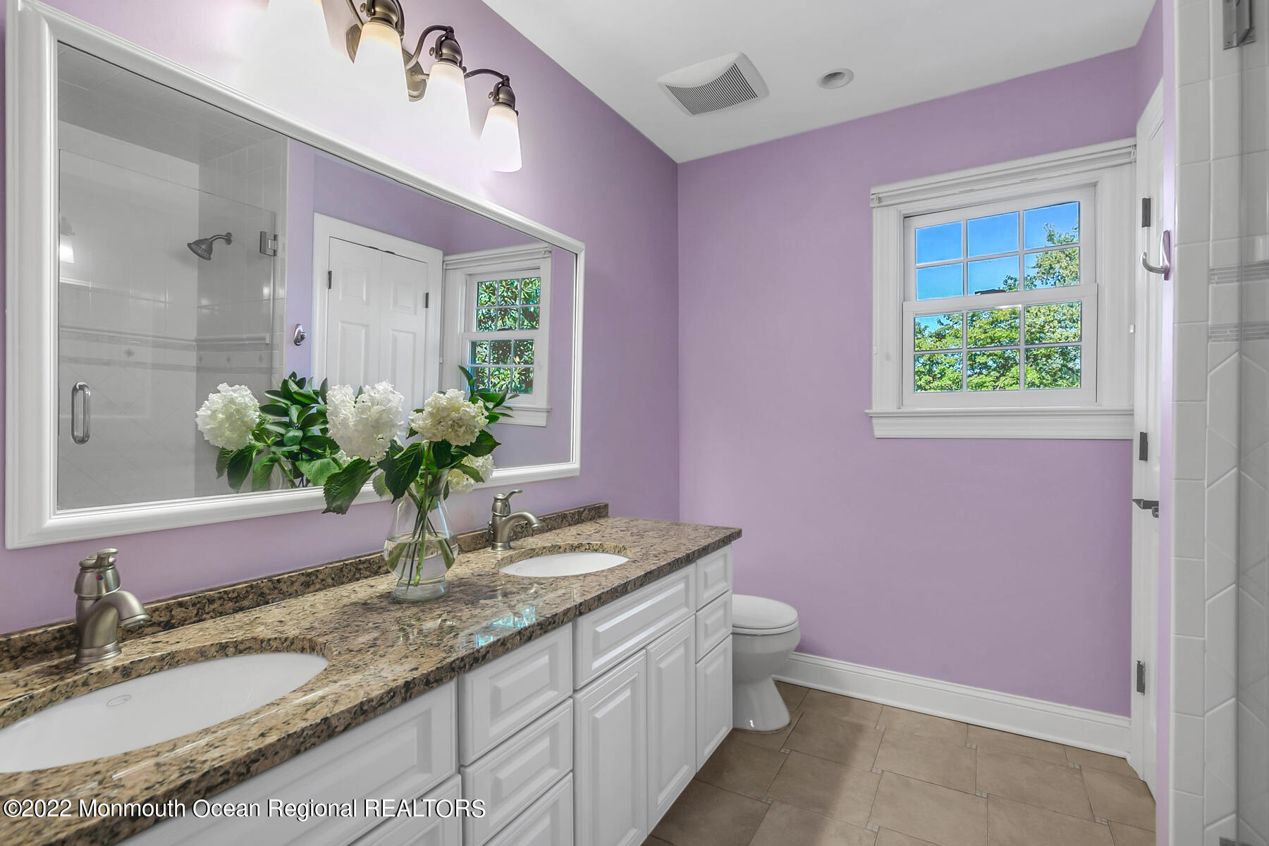 25 Spring Garden Avenue Colts Neck, NJ 07722 - Photo 28 of 58 a bathroom with a granite countertop sink and a mirror