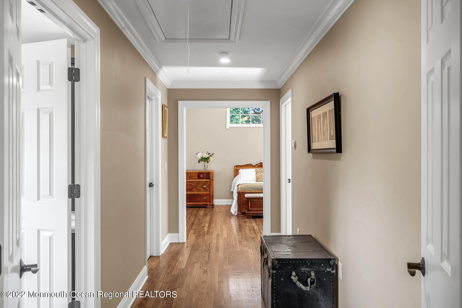 25 Spring Garden Avenue Colts Neck, NJ 07722 - Photo 35 of 58 a hallway with wooden floor windows and a livingroom