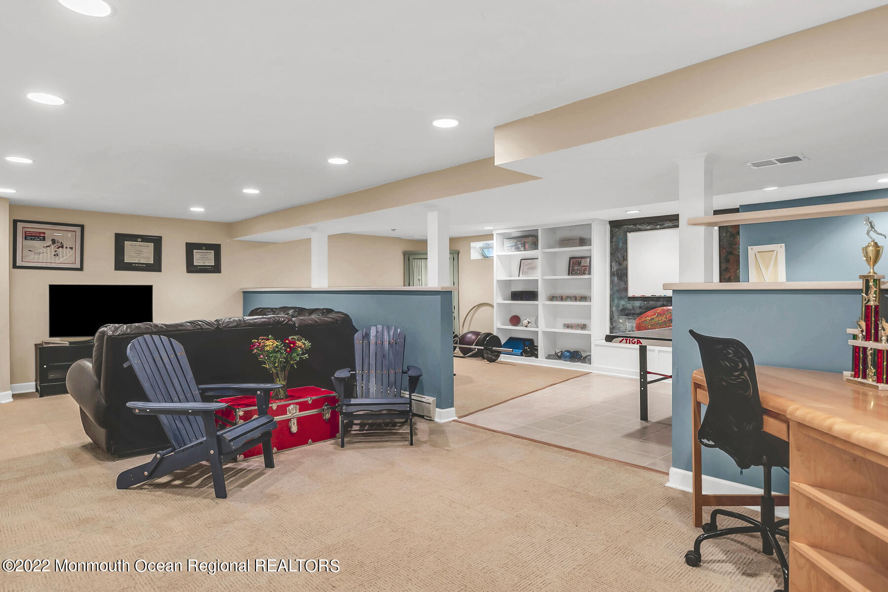25 Spring Garden Avenue Colts Neck, NJ 07722 - Photo 37 of 58 a living room with furniture and a fireplace