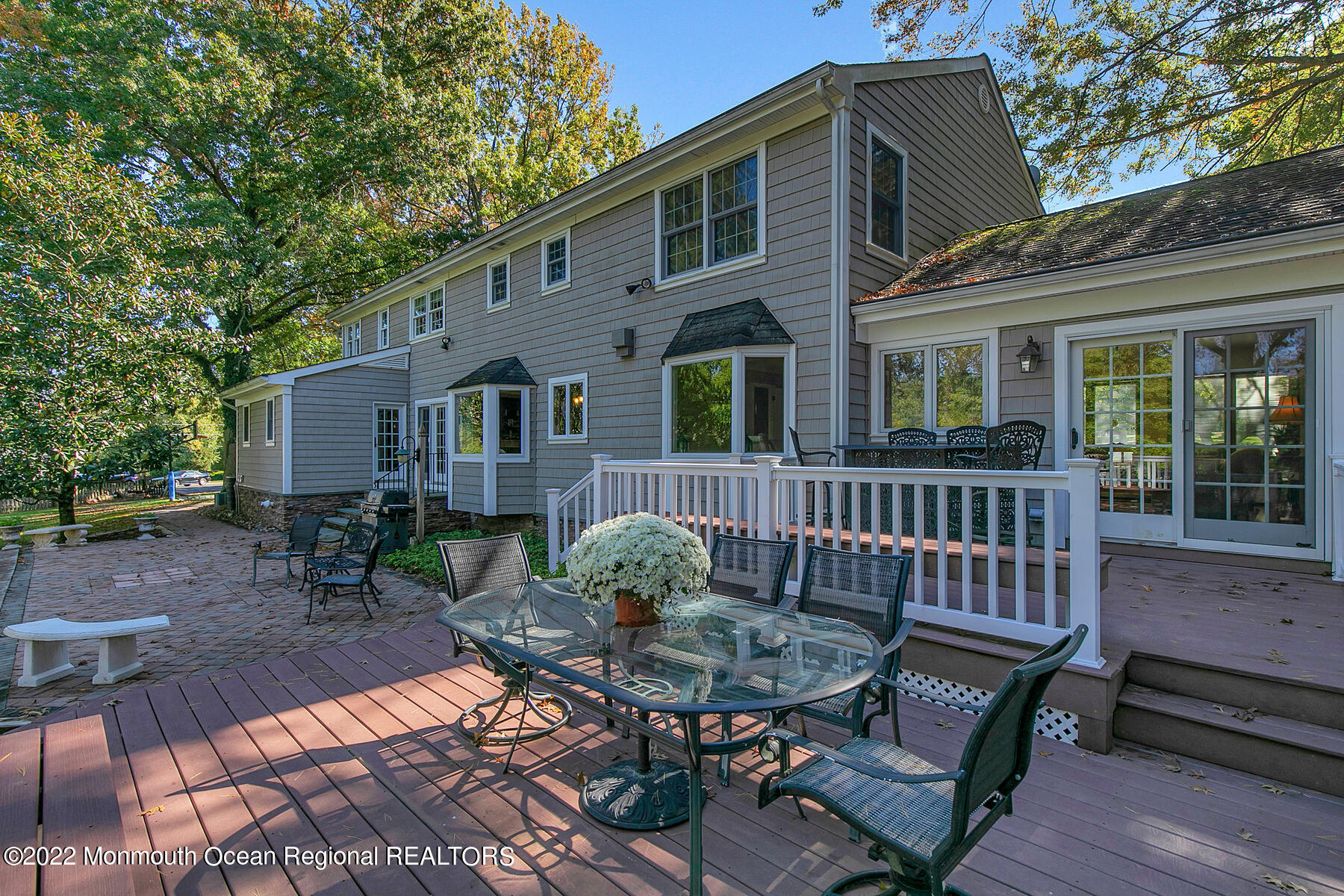 25 Spring Garden Avenue Colts Neck, NJ 07722 - Photo 40 of 58 a view of a chair and table in backyard