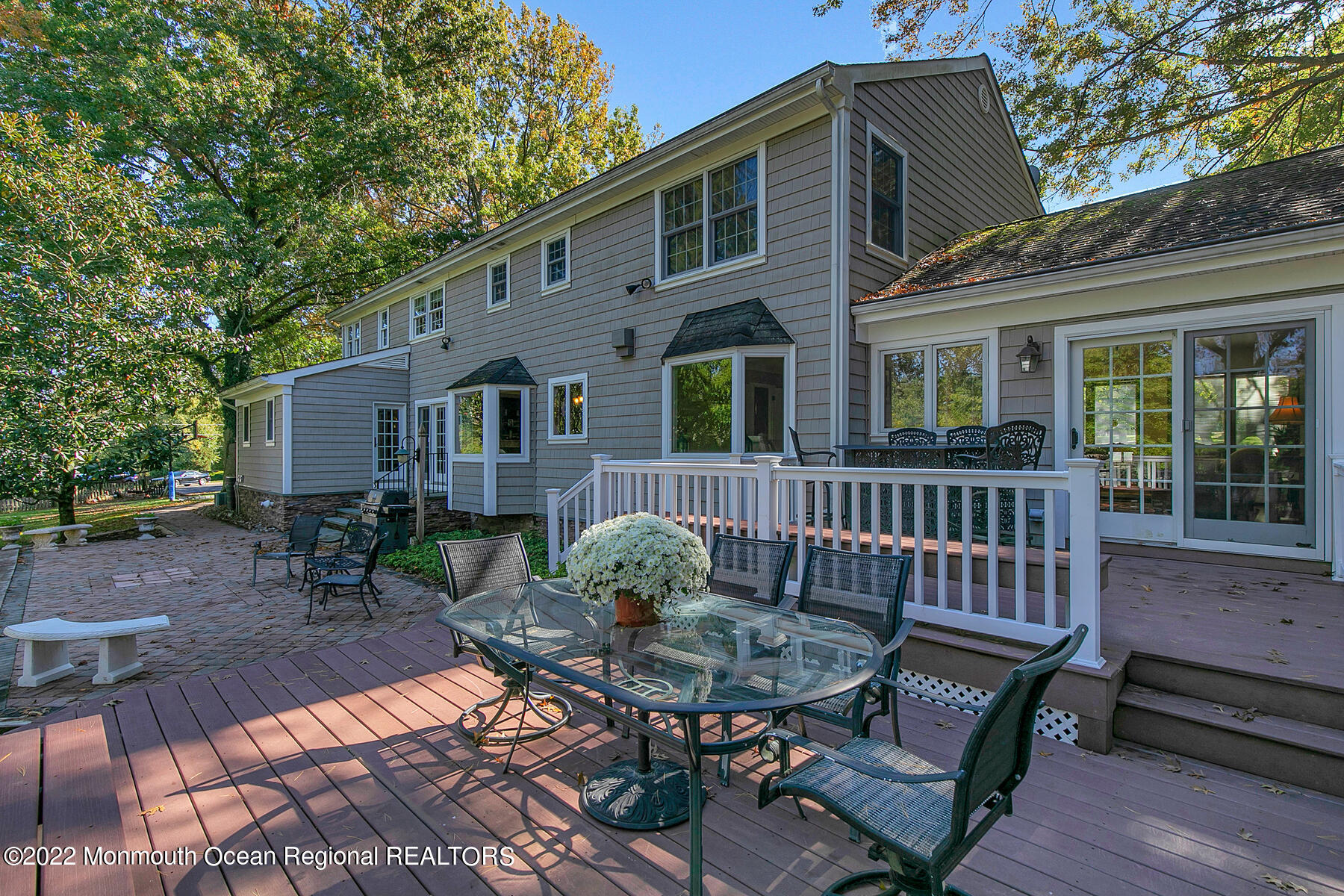 25 Spring Garden Avenue Colts Neck, NJ 07722 - Photo 41 of 58 a view of a chair and table in backyard