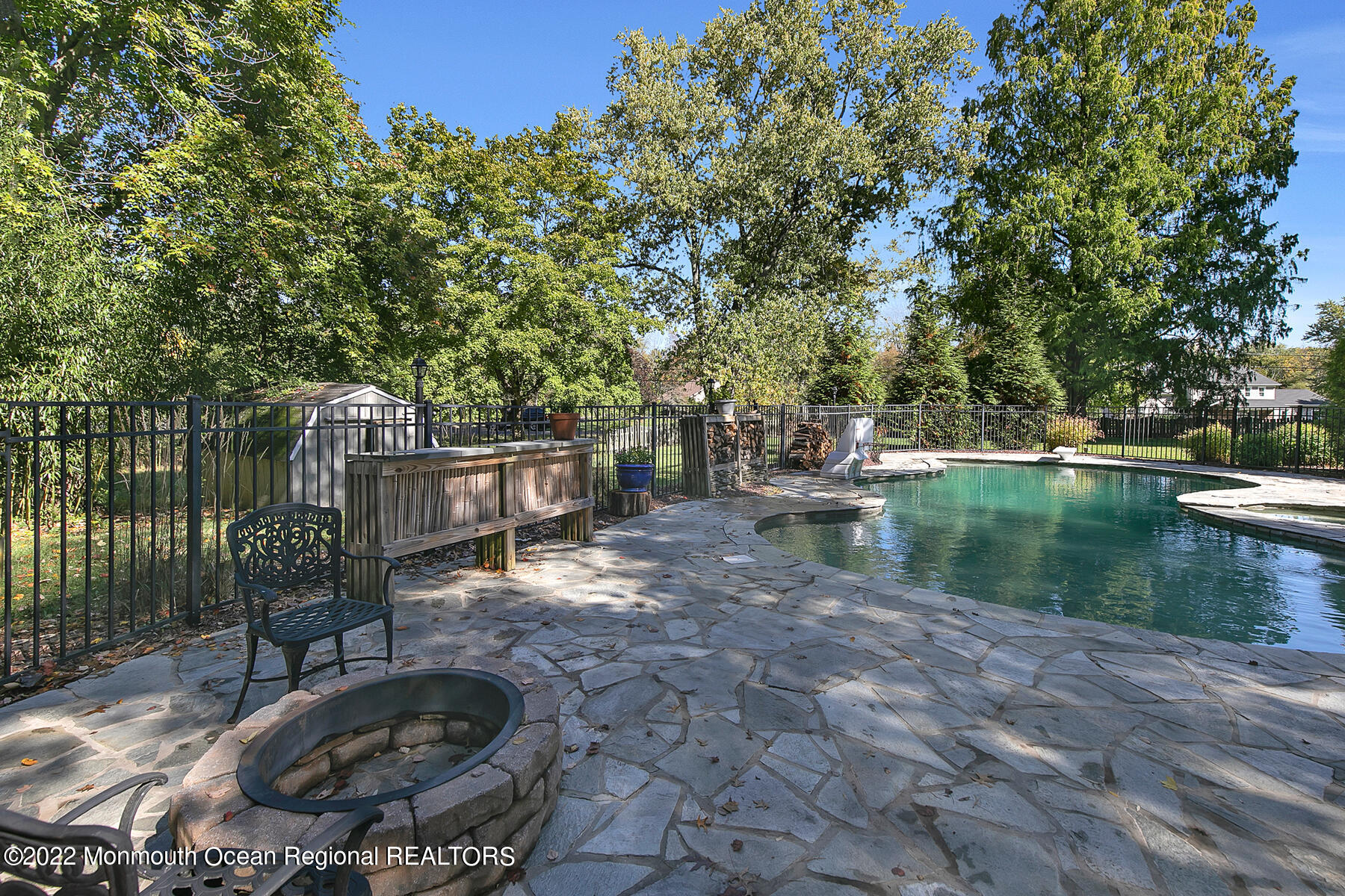 25 Spring Garden Avenue Colts Neck, NJ 07722 - Photo 45 of 58 a view of a lake with a patio