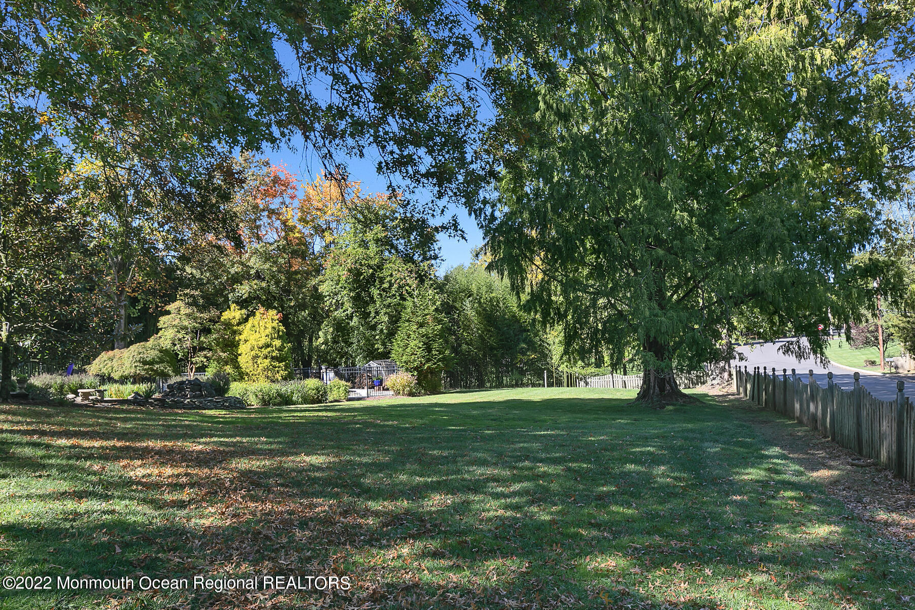 25 Spring Garden Avenue Colts Neck, NJ 07722 - Photo 47 of 58 a backyard of a house with lots of green space