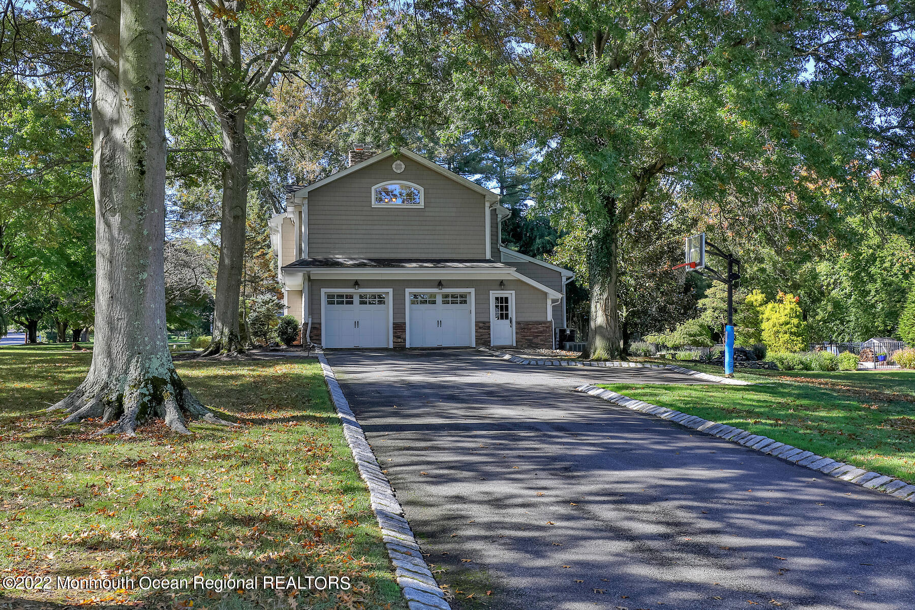 25 Spring Garden Avenue Colts Neck, NJ 07722 - Photo 50 of 58 a front view of a house with garden