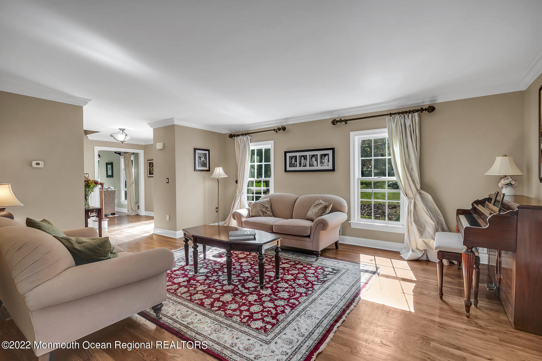 25 Spring Garden Avenue Colts Neck, NJ 07722 - Photo 6 of 58 a living room with furniture a rug and a window