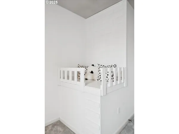 a bathroom with a sink a toilet a mirror and shower