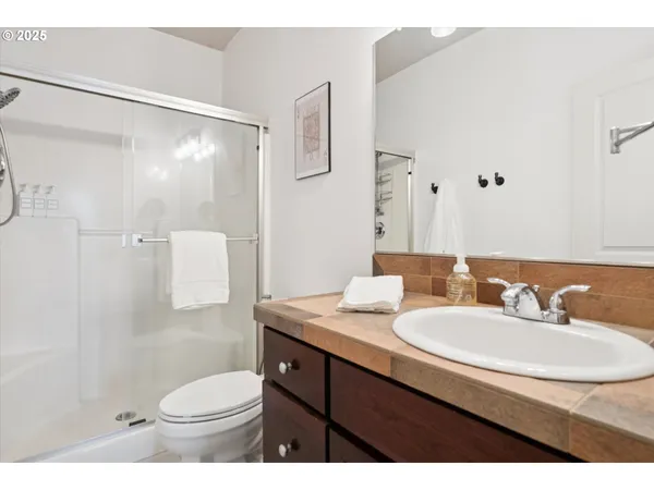 a living room with a fireplace a flat screen tv and a fireplace