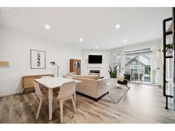 a living room with a bed furniture and a window