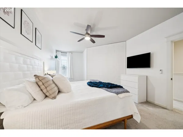 a living room with furniture fireplace and flat screen tv