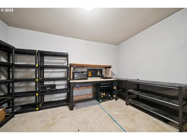 a living room with fireplace furniture and a large window
