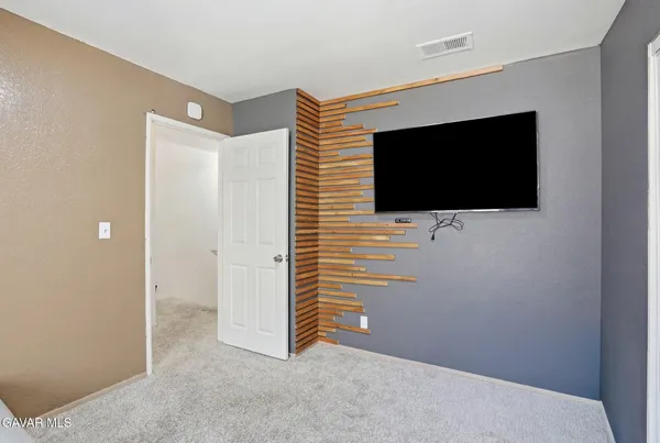 a view of a livingroom with a flat screen tv