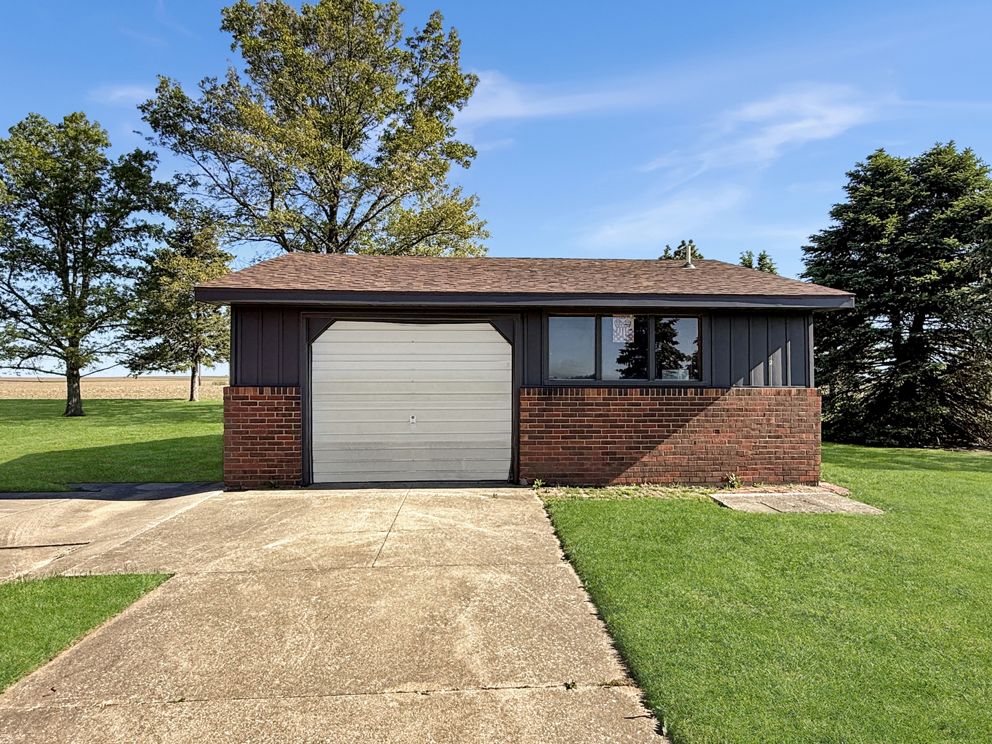 2052 County Road 3000 North Rantoul, IL 61866 - Photo 19 of 21 front view of a house with a yard