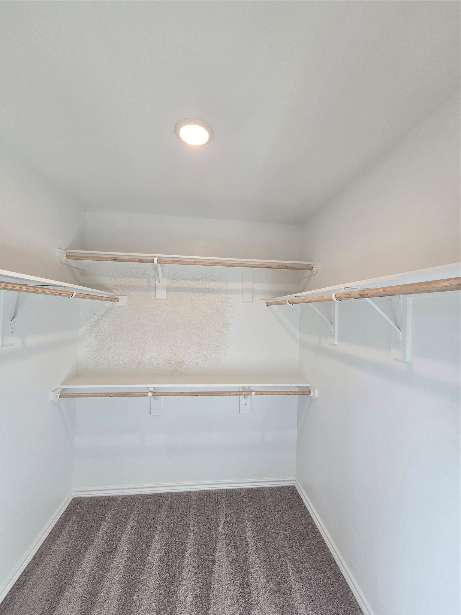 1204 Daniel Street Baytown, TX 77520 - Photo 6 of 11 a view of a room with racks on the wall