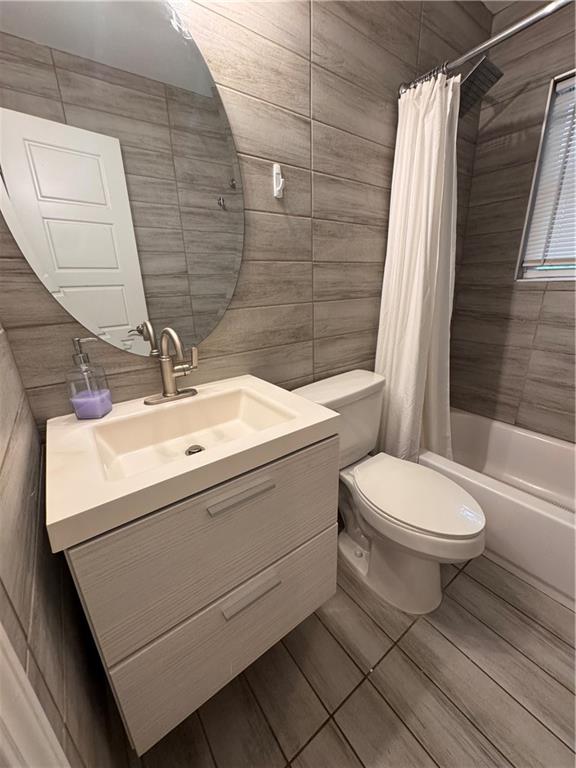 1485 Janmar Drive Decatur, GA 30032 - Photo 11 of 34 a bathroom with a sink a toilet and shower