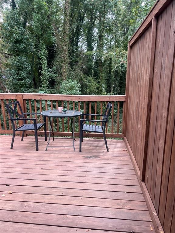 1485 Janmar Drive Decatur, GA 30032 - Photo 25 of 34 a view of balcony with wooden floor and seating space