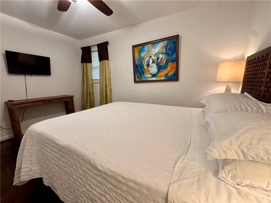 1485 Janmar Drive Decatur, GA 30032 - Photo 9 of 34 a bedroom with a large bed and a flat screen tv