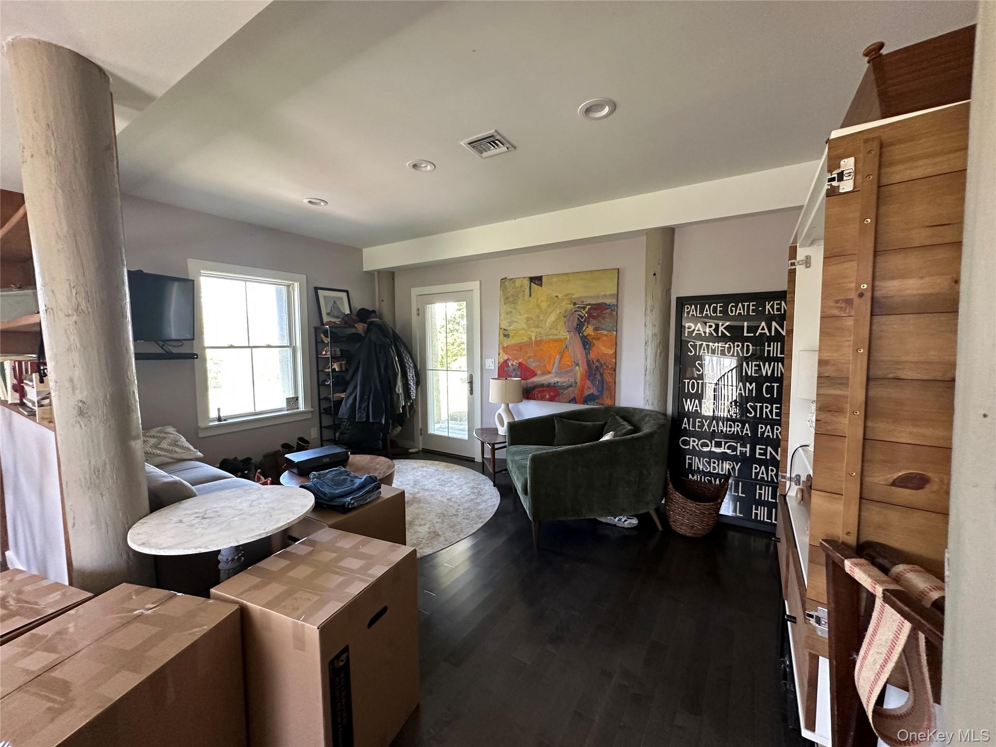 1854 North Bayview Road Southold, NY 11971 - Photo 11 of 20 Living area with dark wood finished floors and recessed lighting