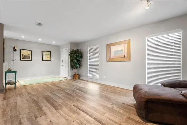 a view of livingroom with furniture and floor to ceiling window