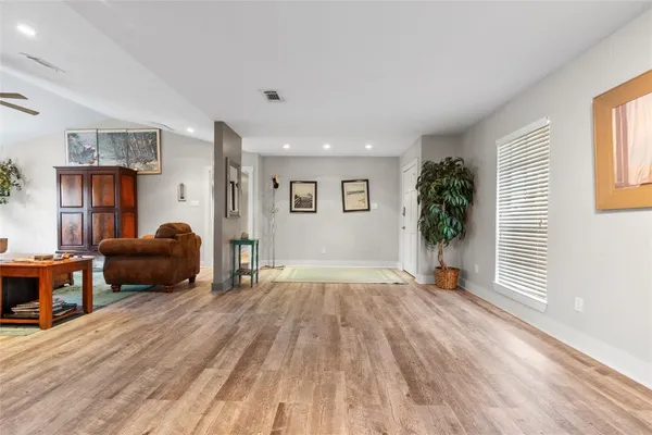 a large kitchen with stainless steel appliances granite countertop a lot of counter space and a sink