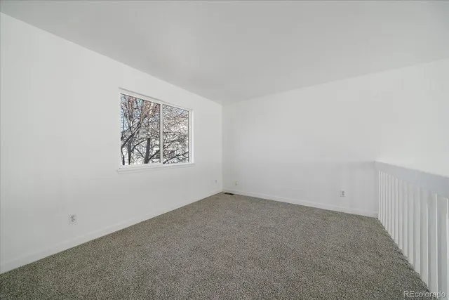 a view of a livingroom with wooden floor