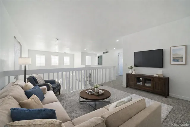 a bedroom with a bed a dresser and mirror